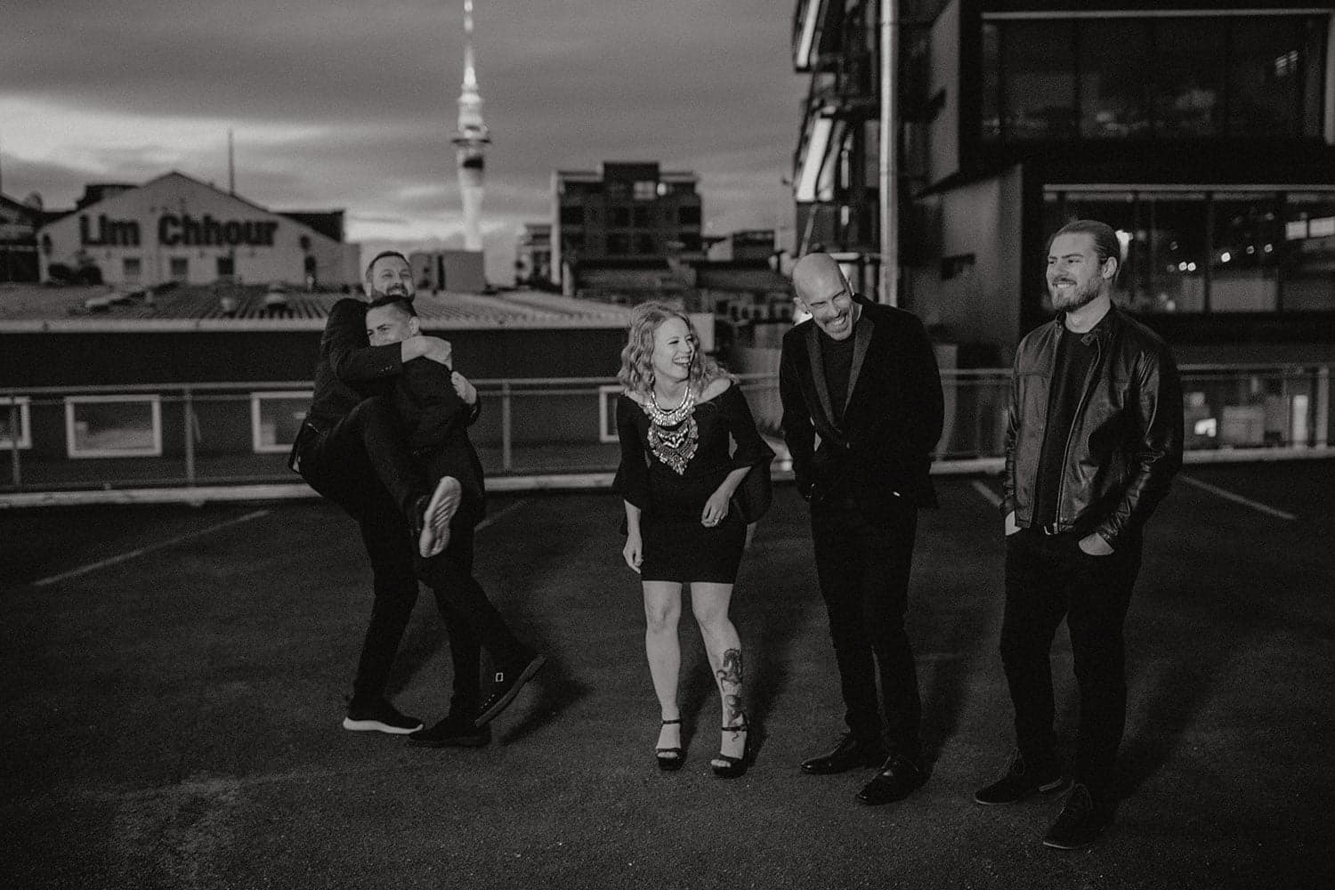 Hands Off band candid moment on Auckland rooftop — wedding entertainment