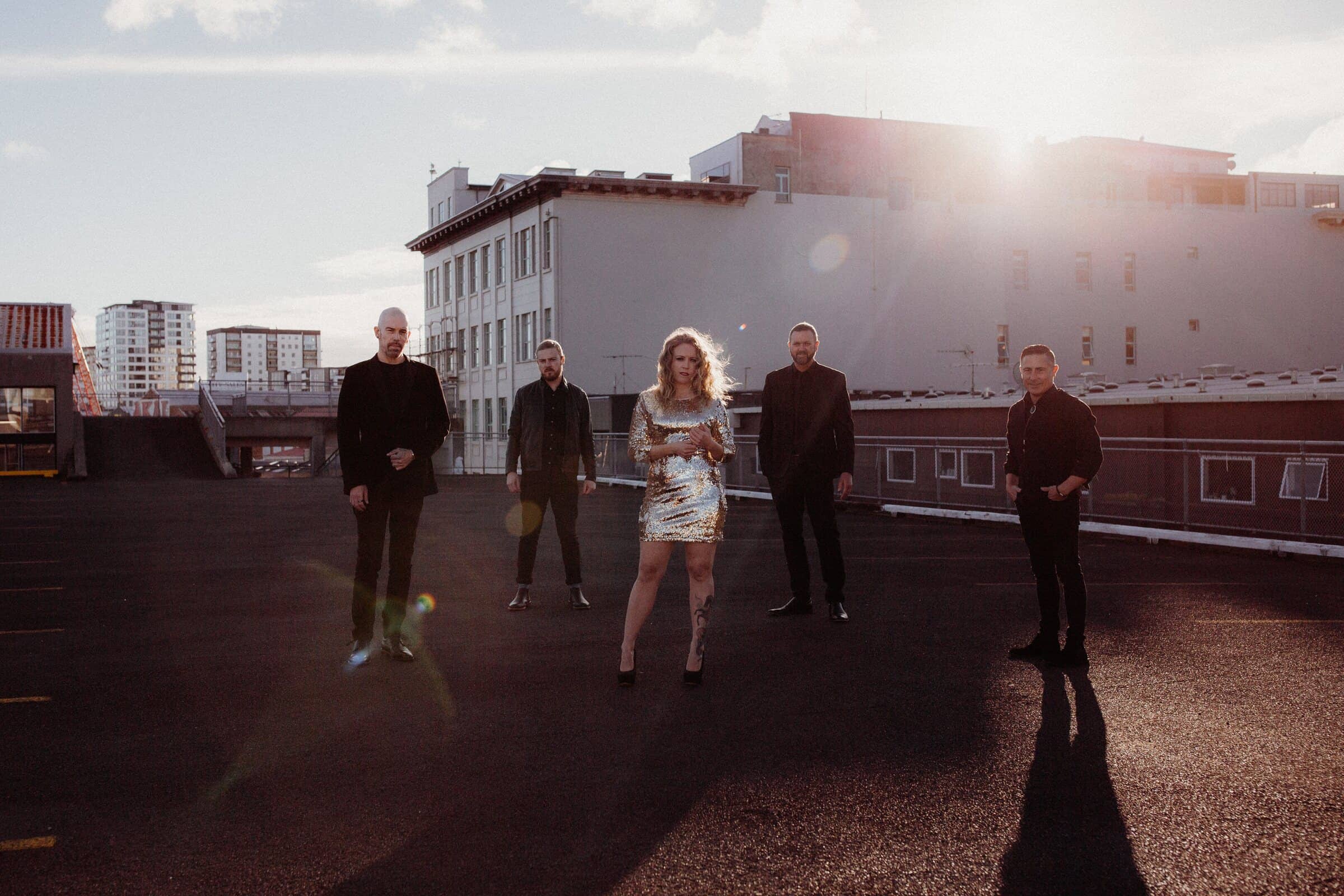 Hands Off on an Auckland rooftop at golden hour